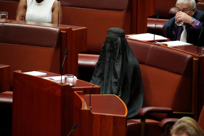 Senator Pauline Hanson wears a burqa during question time in the Senate chamber at Parliament House in Canberra, Australia, Thursday, Aug. 17, 2017.